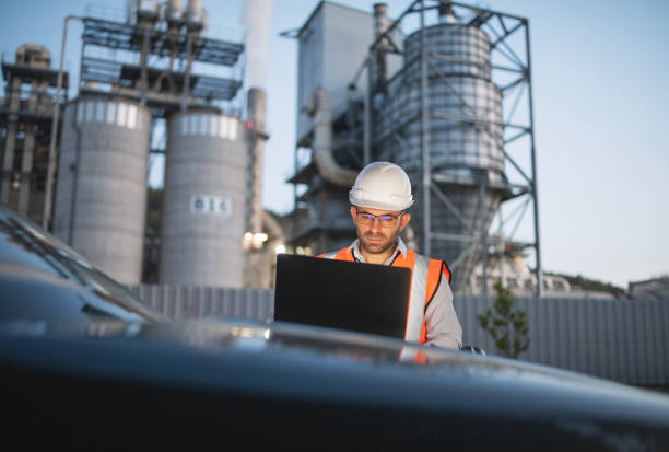 istock Engineer is reptorting a problem with a walkie talkie on the power station at a night shift. 2193599032