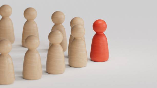 istock A 3d concept graphic depicting a red person standing out from the crowd concept. Rendered against a white background with a soft shadow and reflection to enhance the 3D. 2193606929