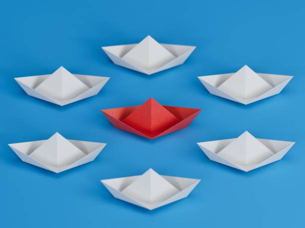 istock Different business concept.new ideas. paper art style. creative idea.3d illustration paper ship and leadership concept.3D rendering on blue background. 2193606966