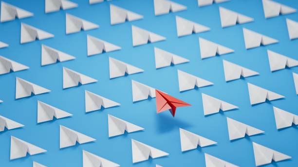 istock Different business concept.new ideas. paper art style. creative idea. red leader plane, standing out from the crowd of white planes.3D rendering on blue background. 2193606990