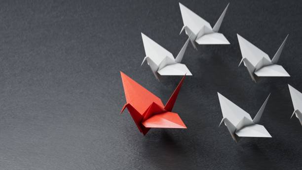 istock Different business concept.new ideas. paper art style. creative idea.Red and white paper swan. leader swan concept.3D rendering on black background. 2193607053