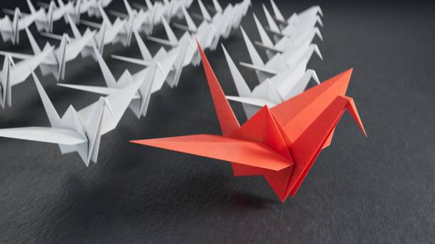 istock Different business concept.new ideas. paper art style. creative idea.leader swan concept using red paper swan among white swans.3D rendering on black background. 2193607063