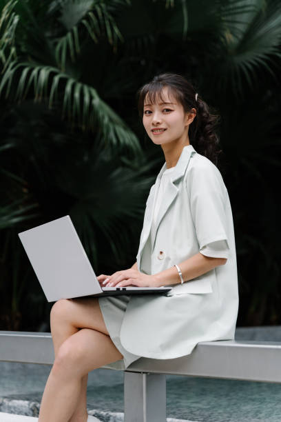 istock Asian young woman working outdoors 2193608731