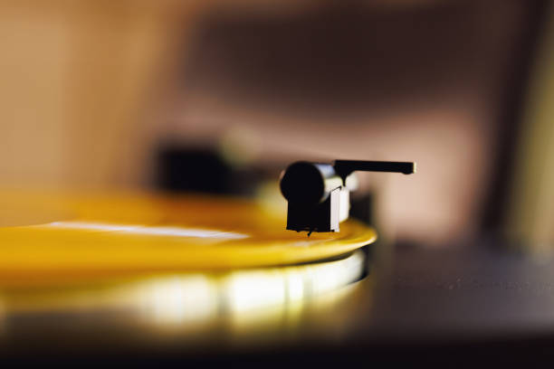 Yellow vinyl record playing on turntable