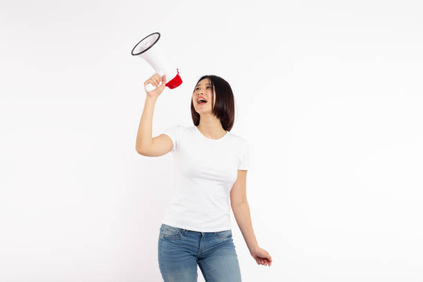 istock Asian woman smiling face holding megaphone shouting, posing isolated on white background, with copy space 2193619732