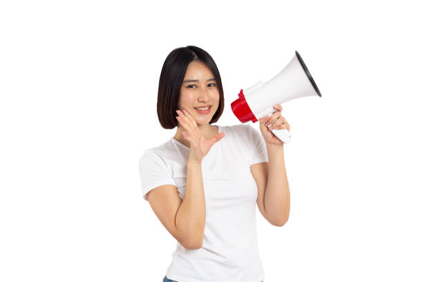 istock Asian woman smiling face holding megaphone shouting, posing isolated on white background, with copy space 2193619747