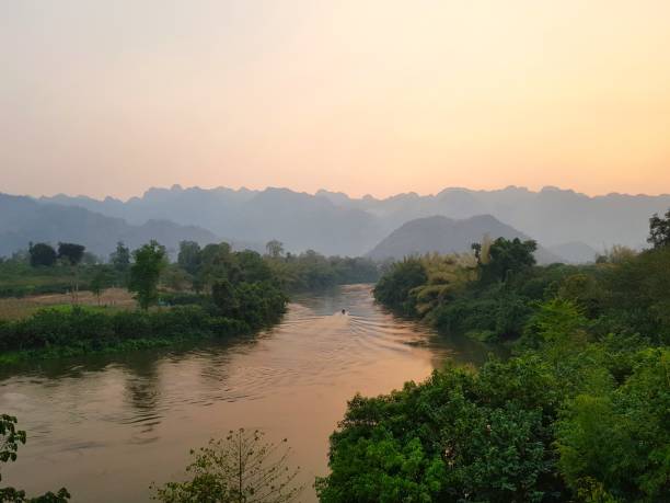 istock Sunset over a River in a Mountainous Landscape 2193623832