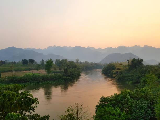 istock Sunset over a River in a Mountainous Landscape 2193623836