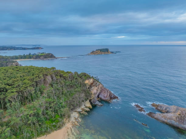 istock Cloud-covered sunrise over Guerilla Bay 2193623877