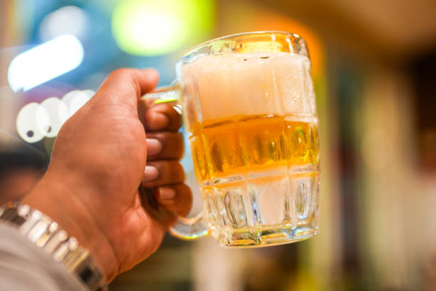 istock Enjoying a frost cold beer in a frozen mug. 2193626379