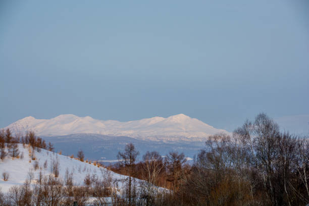 istock Beautiful winter landscape with snow-capped mountains and blue sky 2193630581