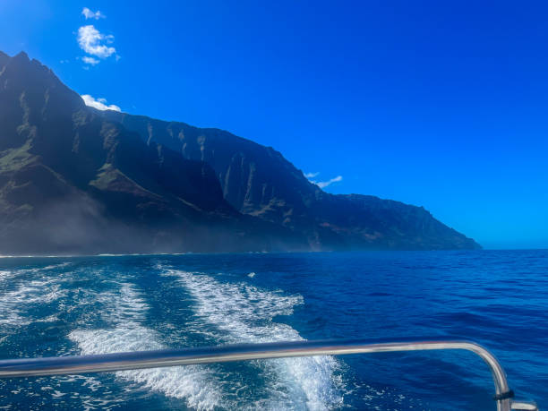 istock Scenic boat ride along the rugged coastline with vibrant blue waters 2193632113