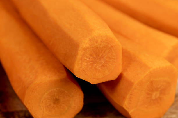 orange carrots on the table during cooking, sweet ripe orange carrots peeled and washed for cooking