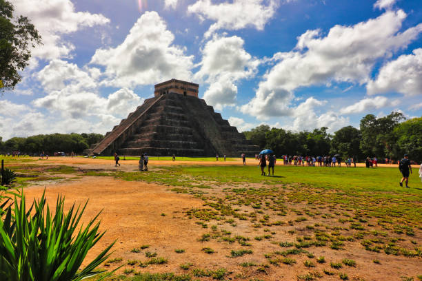 Chichen Itza,Mexico,October 21,2024-Cloudy yet bright skies over the Temple Pyramid of Kukulcan,El Castillo, Great Mayan ruins, attracts millions of tourists to Mexico every year at Chichen Itza