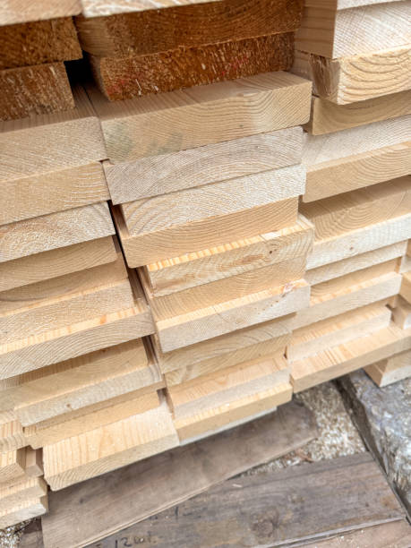istock A stack of wood planks with a few of them being cut 2193636667