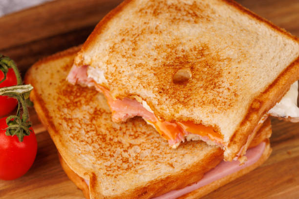 istock Gourmet Sandwiches with Cherry Tomatoes on a Concrete Table with a Red Napkin 2193637419
