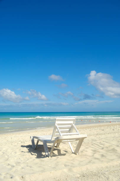 istock sunbeds and costline  at tropical beach 2193637831