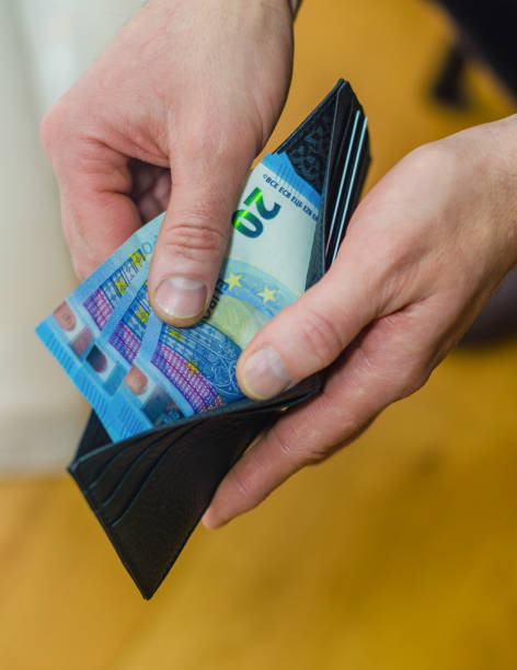 istock Hand Holding Wallet with Euro Banknotes Close-Up 2193639008