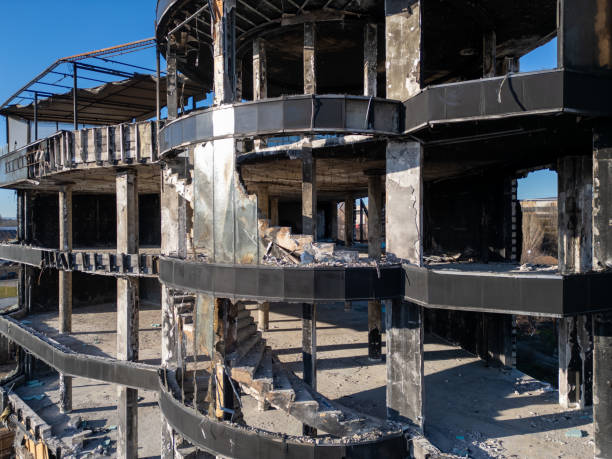 A damaged commercial building or hotel after a devastating fire. The exposed structure and charred remains showcase the aftermath of destruction, perfect for themes of disaster, urban decay, and reconstruction