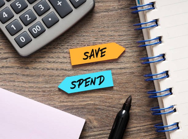 istock Save or spend choice representing investment, budgeting, and financial decision making 2193640795