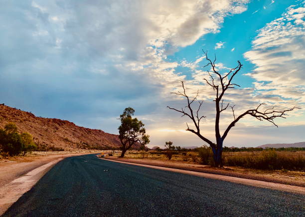 istock Australian outback road at sunset 2193641091