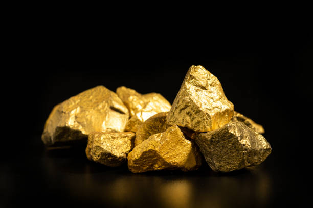 istock The pure gold ore found in the mine on black background 2193643467