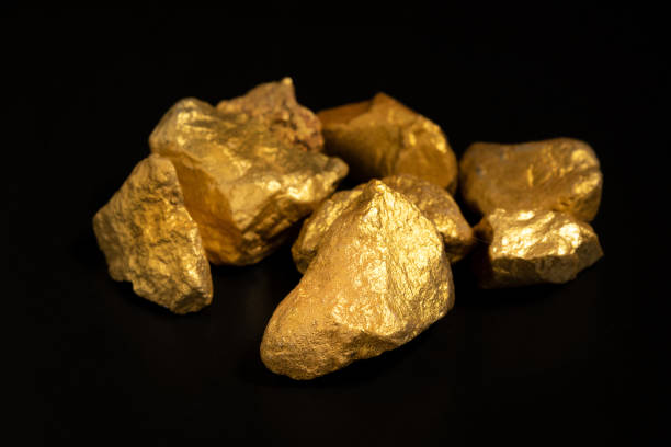 istock The pure gold ore found in the mine on black background 2193643505