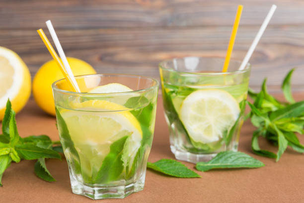 istock Mojito summer refreshing cocktail with ice and mint. mojito cocktail with lime, lemon and mint in a tall glass with a stick 2193644698