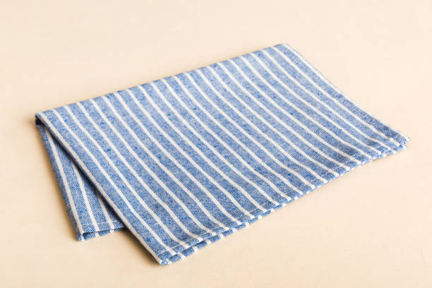 istock top view with blue kitchen napkin isolated on table background. Folded cloth for mockup with copy space, Flat lay. Minimal style 2193644713