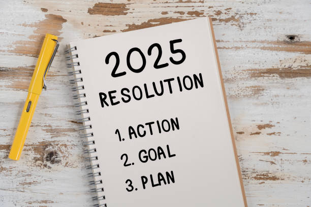 istock 2025 Happy New Year Resolution Goal List and Plans Setting. Business office desk with notebook written about plan listin 2193645701
