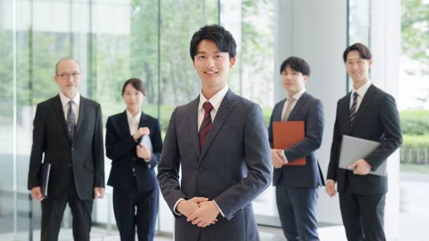 istock Asian businessman standing with a smile 2193646027