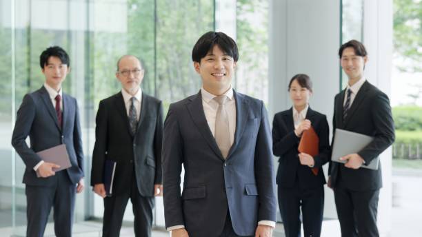 istock Asian businessman standing with a smile 2193646029