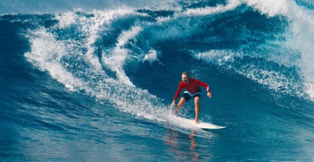 istock Pro surfer rides big wave in the Maldives 2193646515