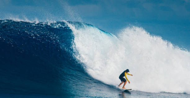 istock Pro surfer rides big wave in the Maldives 2193646521