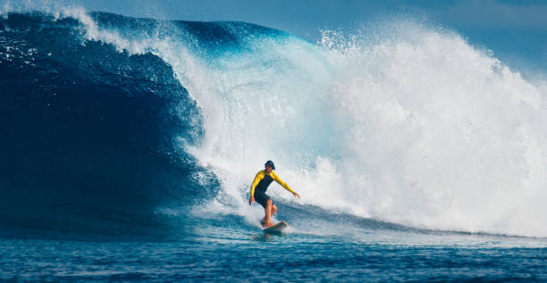 istock Pro surfer rides big wave in the Maldives 2193646523