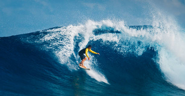istock Pro surfer rides big wave in the Maldives 2193646526