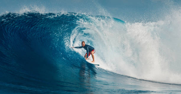 istock Pro surfer rides big wave in the Maldives 2193646528