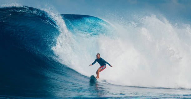 istock Pro surfer rides big wave in the Maldives 2193646529