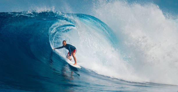 istock Pro surfer rides big wave in the Maldives 2193646531