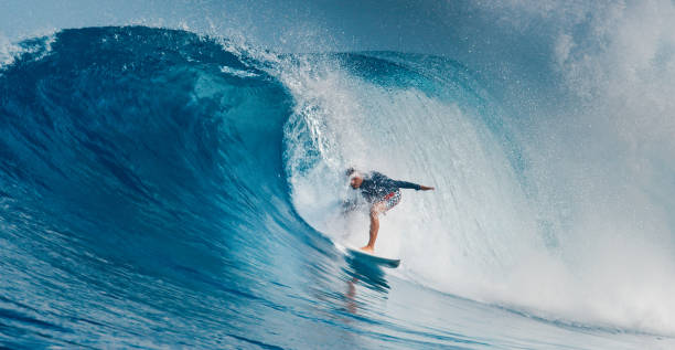 istock Pro surfer rides big wave in the Maldives 2193646532