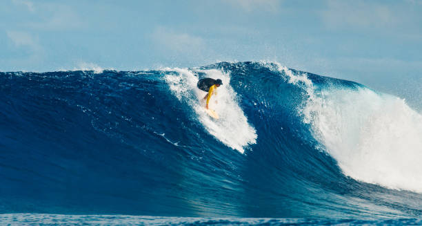 istock Pro surfer rides big wave in the Maldives 2193646534