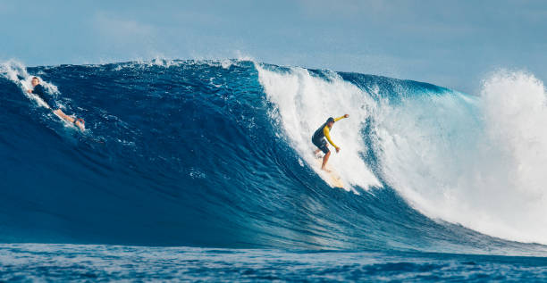 istock Pro surfer rides big wave in the Maldives 2193646536