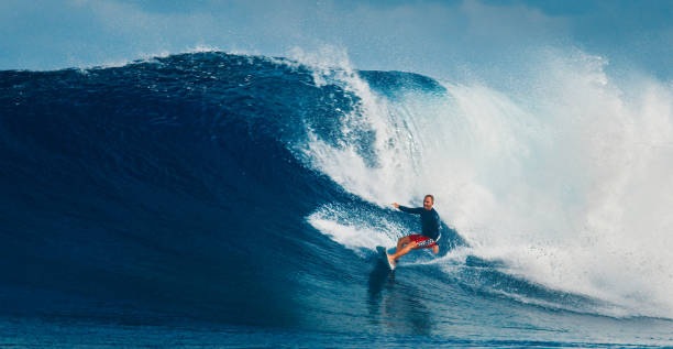 istock Pro surfer rides big wave in the Maldives 2193646539