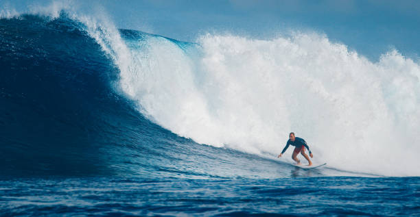istock Pro surfer rides big wave in the Maldives 2193646540