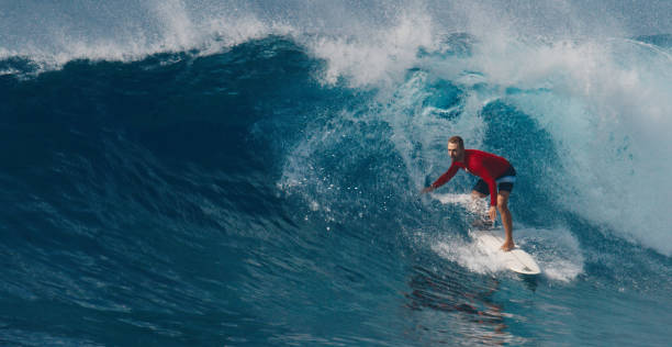 istock Pro surfer rides big wave in the Maldives 2193646544