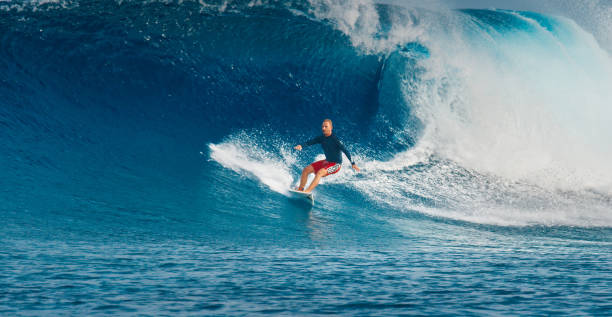 istock Pro surfer rides big wave in the Maldives 2193646548