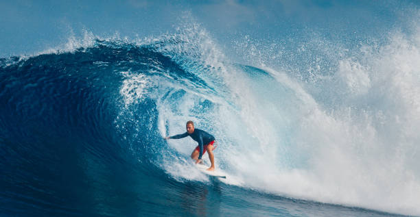 istock Pro surfer rides big wave in the Maldives 2193646550