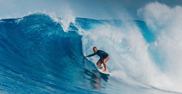istock Pro surfer rides big wave in the Maldives 2193646553