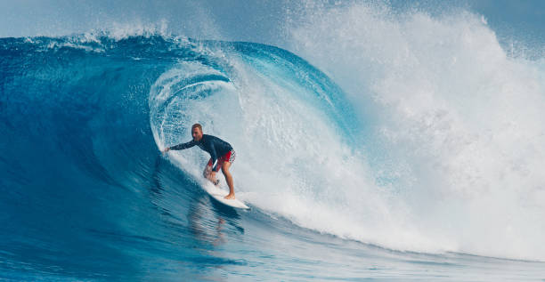 istock Pro surfer rides big wave in the Maldives 2193646554