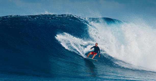 istock Pro surfer rides big wave in the Maldives 2193646557